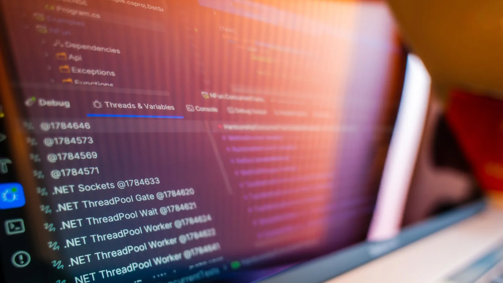 Developer looking at error console on a laptop